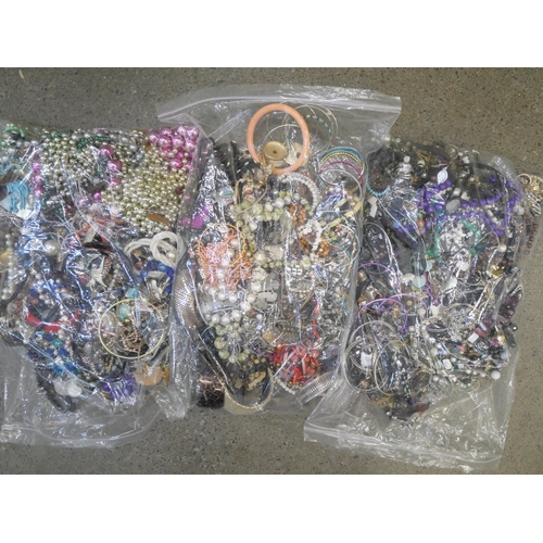 729 - Three bags of costume jewellery