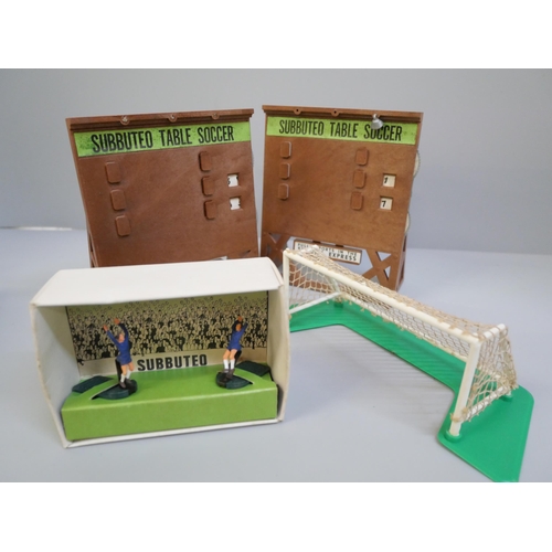 752 - A collection of Subbuteo accessories including scoreboards, throw in figures and goalkeepers, all 19... 