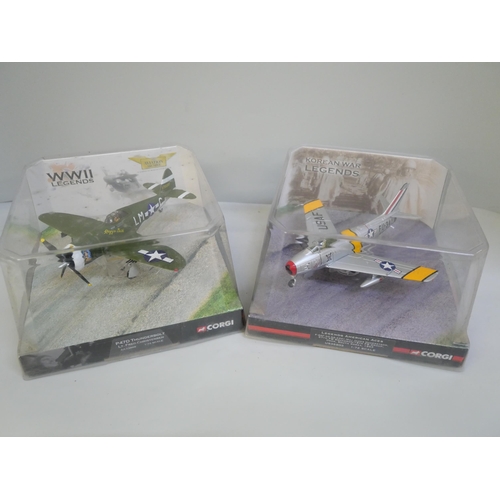 768 - Four Corgi model aircrafts including two WWII Legends