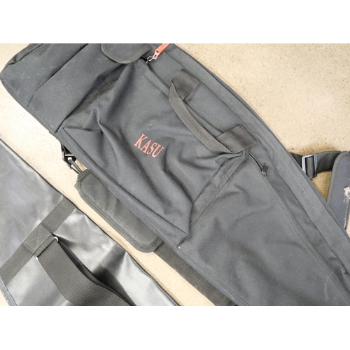 808 - A Vanguard Pro 768 gun support with padded rest and three rifle soft cases