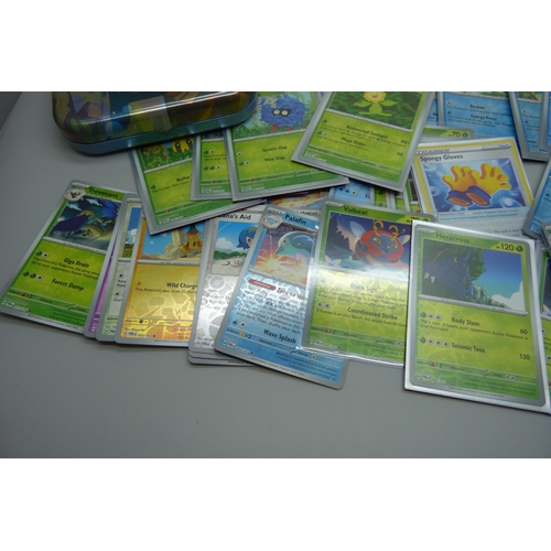 828 - 100 plus holographic Pokémon cards including reverse holo and collector's tins