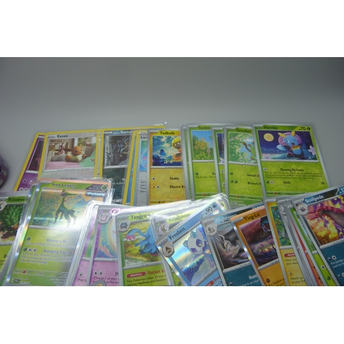 828 - 100 plus holographic Pokémon cards including reverse holo and collector's tins