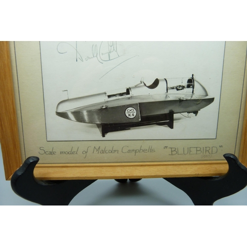 829 - A mounted photograph of a scale model of Malcolm Campbells K4 'Blue Bird', signed by Donald Campbell... 