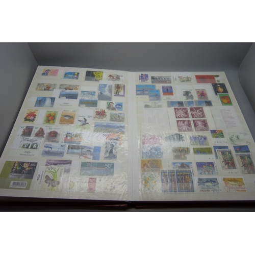 830 - Stamps; a stockbook of Iceland stamps mainly from 1990s and 2000s but some earlier, (the mint stamps... 