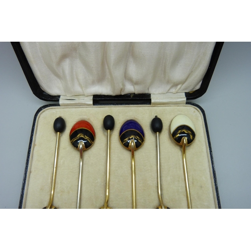 839 - A set of six gilt metal and enamelled coffee bean spoons, in a box