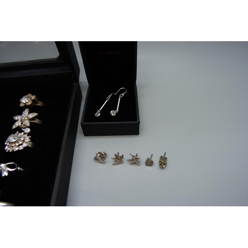 840 - A collection of costume rings and silver earrings