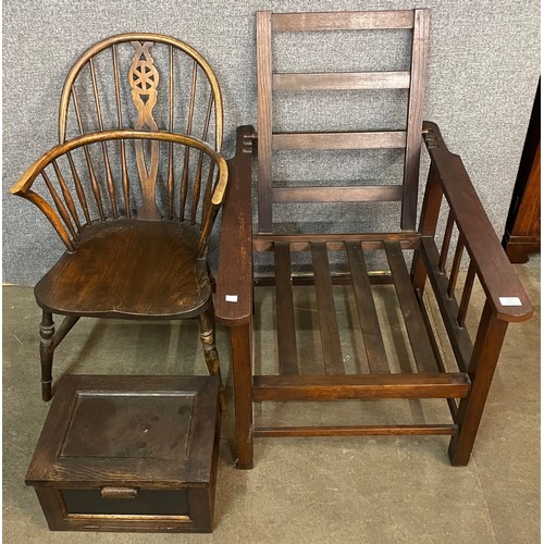 223 - An Edward VII oak reclining armchair, a 19th Century elm Windsor chair and a small oak cabinet