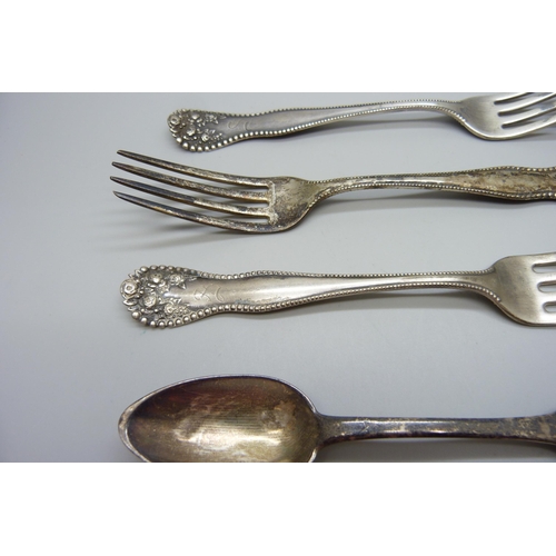 850 - Three silver forks and a silver spoon, 139g, (continental mark on the spoon)