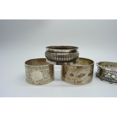 858 - Five silver napkin rings, one with continental mark, 124g, and a plated napkin ring