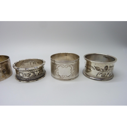 858 - Five silver napkin rings, one with continental mark, 124g, and a plated napkin ring