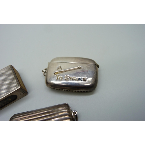 881 - A silver matchbox holder, a 925 silver case and a silver vesta case, 'A Match to Strike'