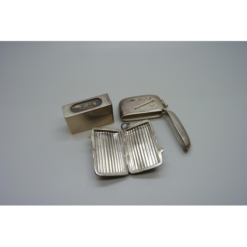 881 - A silver matchbox holder, a 925 silver case and a silver vesta case, 'A Match to Strike'