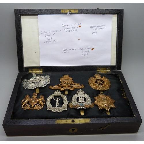 905 - A collection of seven military regiment cap badges