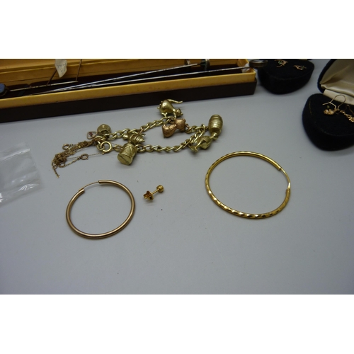 906 - A collection of hat pins and stick pins, one stick pin 9ct gold and set with a small diamond, a plat... 