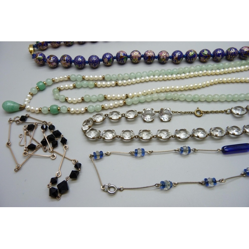 916 - Six vintage necklaces including amber coloured, jade, pearl, etc.