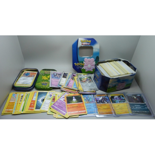 922 - 500 plus Pokémon cards including colour graphic and Pokémon tins