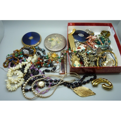 925 - A box of costume jewellery, compacts, etc.