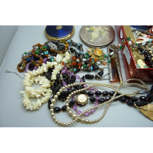 925 - A box of costume jewellery, compacts, etc.