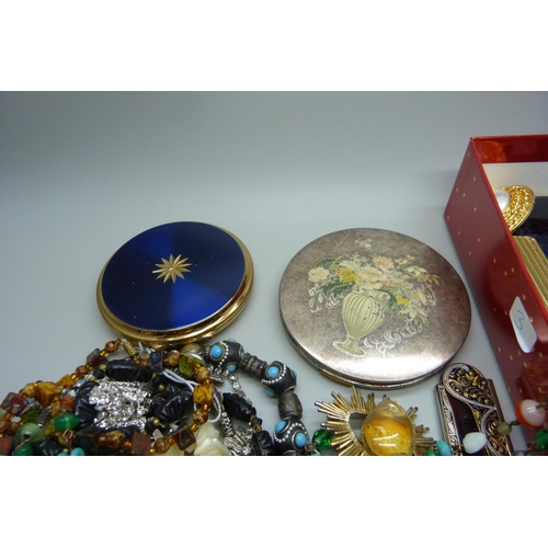 925 - A box of costume jewellery, compacts, etc.