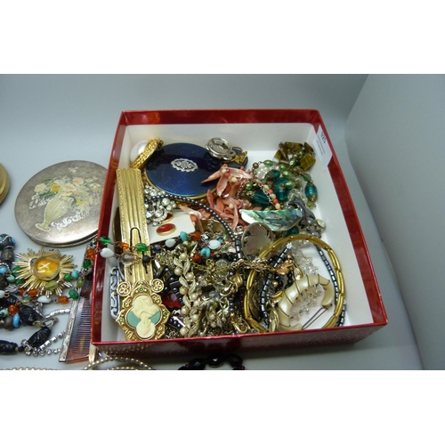 925 - A box of costume jewellery, compacts, etc.