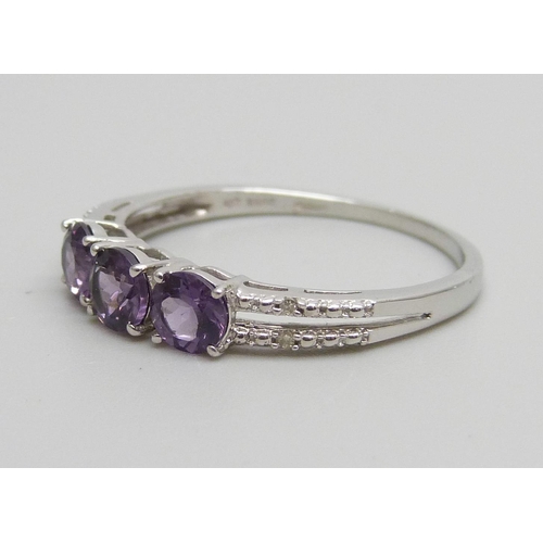 937 - A 9ct white gold, amethyst and diamond ring, 2g,  S