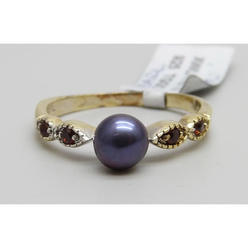 938 - A silver gilt, black pearl and garnet ring, U