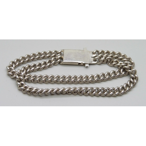 940 - A silver double curb bracelet with continental marks, 43g