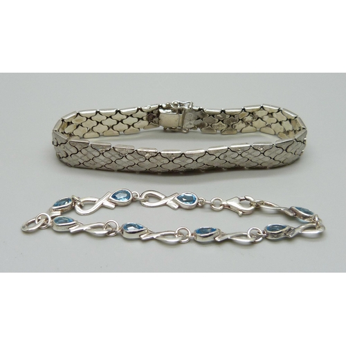 945 - Two silver bracelets, 35g