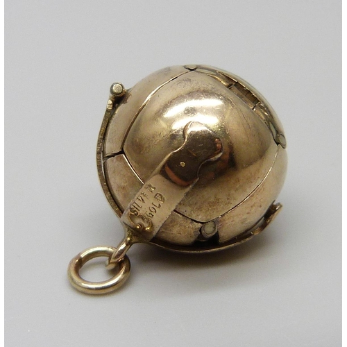 951 - A Masonic ball pendant, marked 'silver & gold'