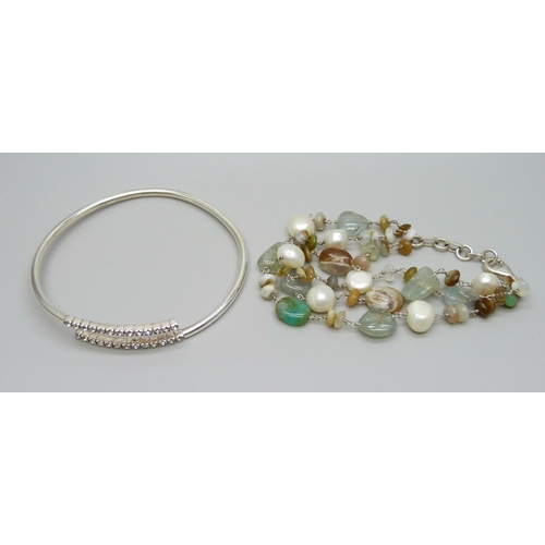 953 - A silver stone mounted triple row bracelet and a silver bangle