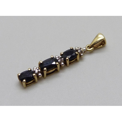 972 - A 9ct gold, diamond and sapphire pendant, 0.9g, 23mm