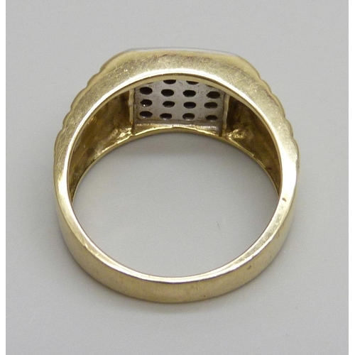 975 - A 9ct gold ring set with diamonds, 8.1g, R, 0.25 carat diamond weight