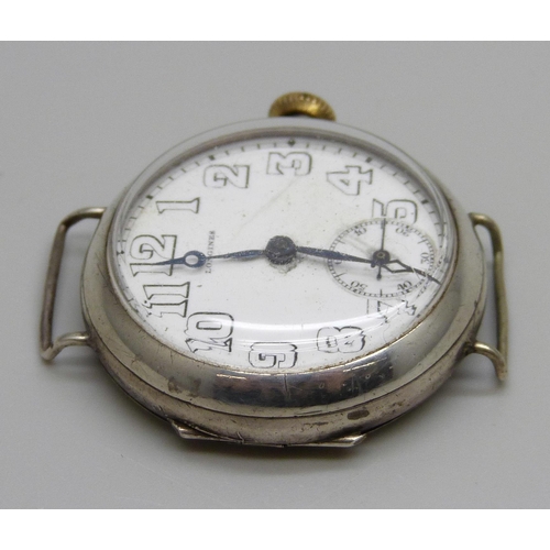 976 - A Longines silver cased wristwatch with engraved case back, the case marked A.W.C. Co., 32mm case