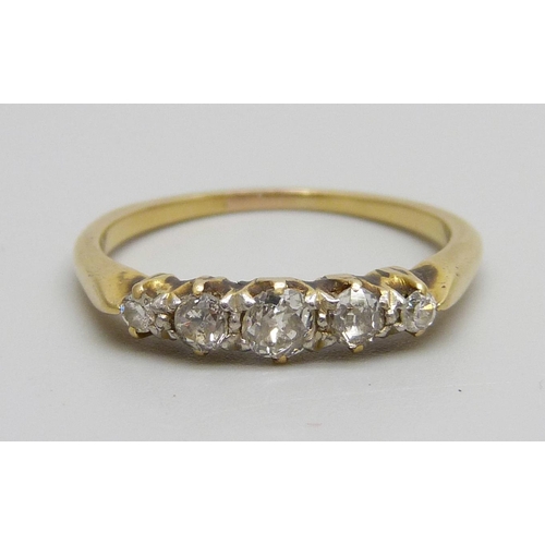 980 - A yellow metal ring set with five diamonds, 2.6g, N