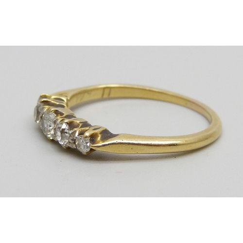 980 - A yellow metal ring set with five diamonds, 2.6g, N