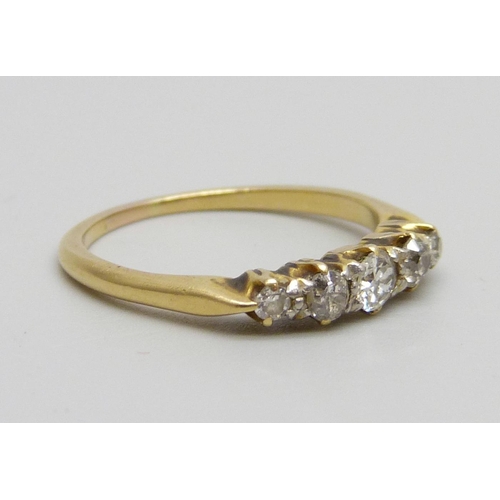 980 - A yellow metal ring set with five diamonds, 2.6g, N