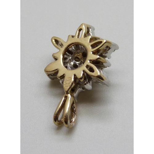 985 - A 9ct gold and diamond 'snowflake' pendant, 1.8g