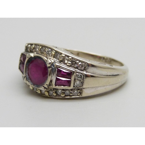 996 - An 18ct gold, ruby and diamond ring, marked 750, 4.6g, O