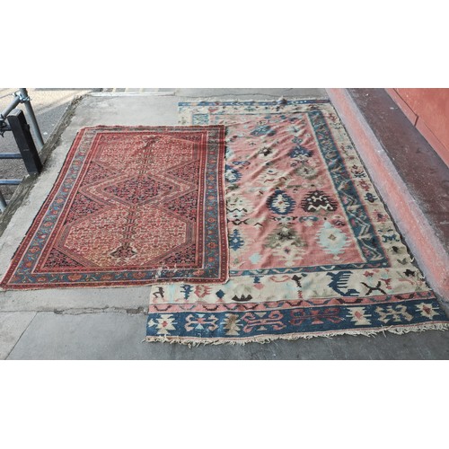 200 - A hand knotted blue ground rug and two others