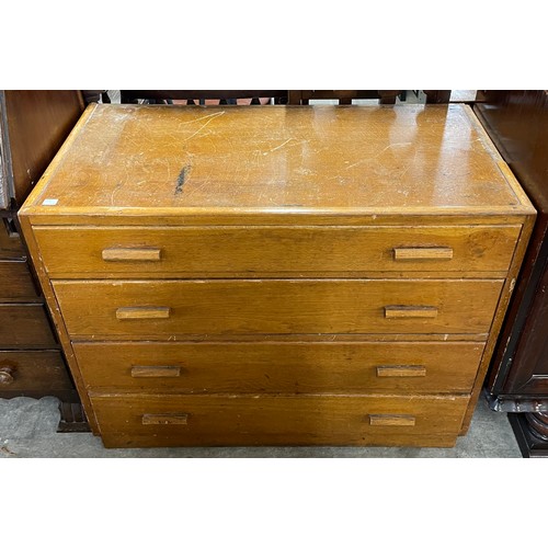 216 - A carved oak sideboard, carved oak bureau and an oak chest of drawers