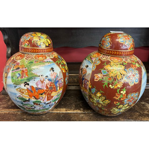 311 - A pair of Oriental style porcelain ginger jars and covers