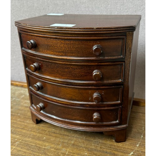 314 - A George III style miniature mahogany bow front chest of drawers