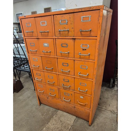 253 - A painted orange metal industrial 20-drawer cabinet