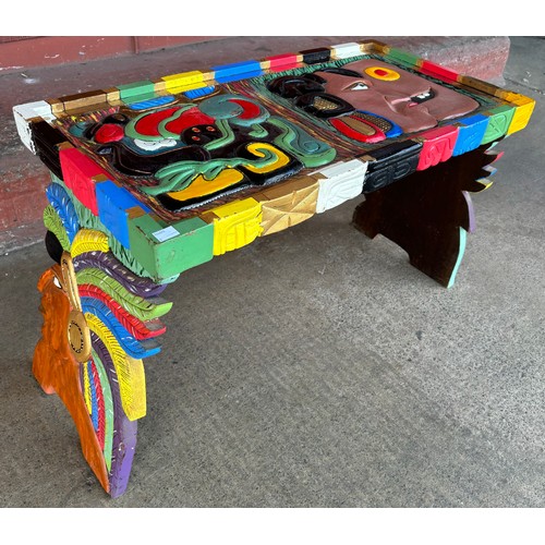 236A - A hand painted carved coffee table, with Aztec figures