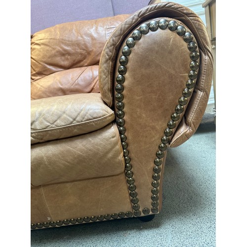 3196 - A brown leather two seater sofa