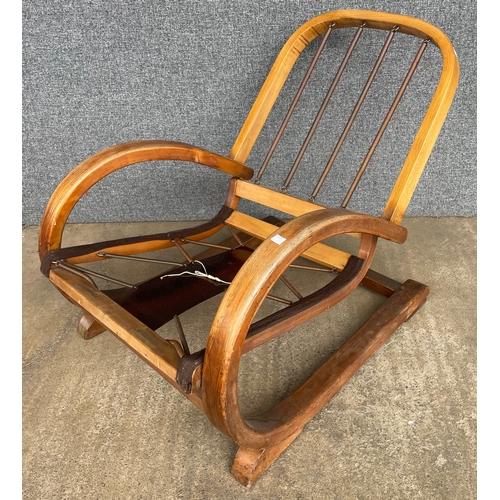 107A - An Art Deco Famulus beech cantilever armchair, designed by J.P. Hully for P.E . Gane & Co.