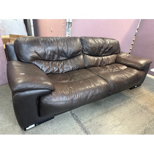 3197 - A brown four seater leather sofa