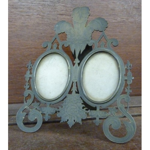 635 - A brass twin picture frame, decorated with Prince of Wales feathers