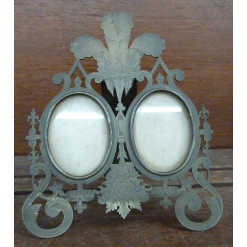 635 - A brass twin picture frame, decorated with Prince of Wales feathers