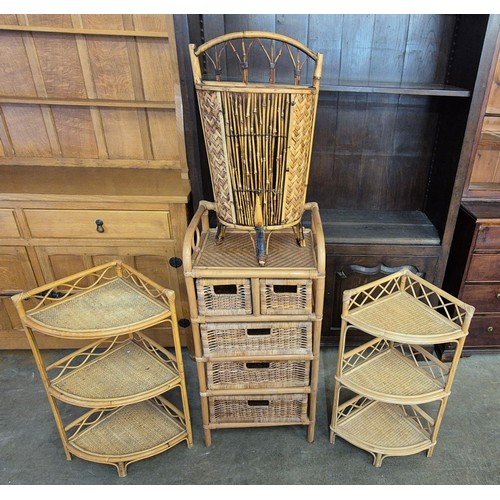 62 - An Italian style bamboo and rattan chest of drawers, a pair of corner whatnots and an umbrella stand